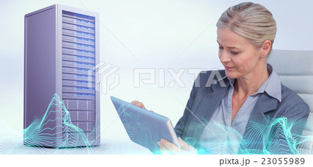 Composite image of businesswoman using tablet Composite image of businesswoman using tablet 23055989
