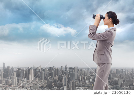 Composite image of portrait of a happy businesswoman looking thr 23056130