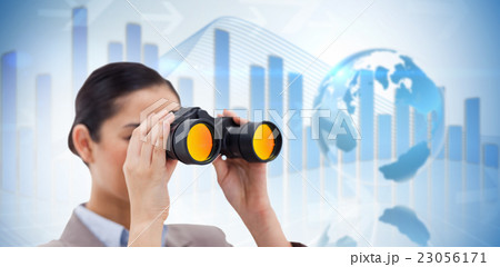 Composite image of brunette businesswoman looking through binocu 23056171