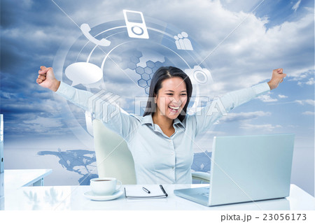 Composite image of happy businesswoman with raised arms 23056173