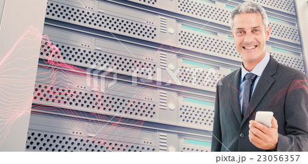Composite image of businessman using a smartphone with colleague 23056357