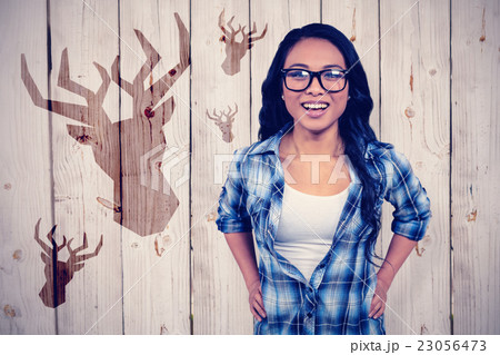 Composite image of asian woman smiling to the camera 23056473