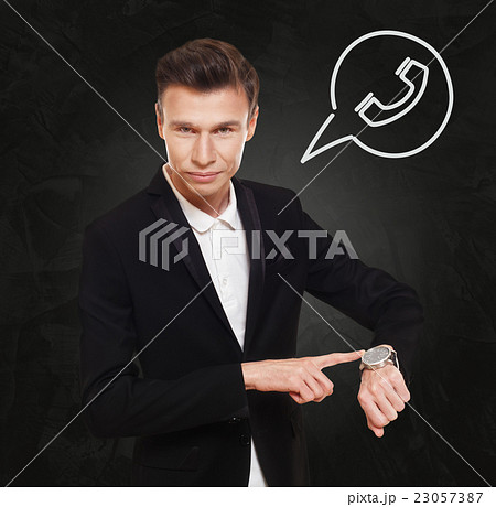 Businessman points at watch, time to call 23057387