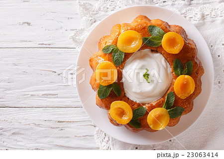 Savarin French dessert with apricots 23063414