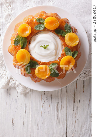 Savarin French dessert with apricots  23063417