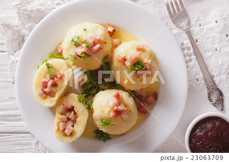 potato dumplings with bacon and lingonberry sauce 23063709