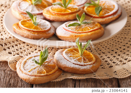 cookies with almonds and oranges closeup cookies with almonds and oranges closeup 23064141