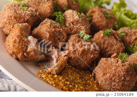 Bitterballen veal with mustard on a plate Bitterballen veal with mustard on a plate 23064189
