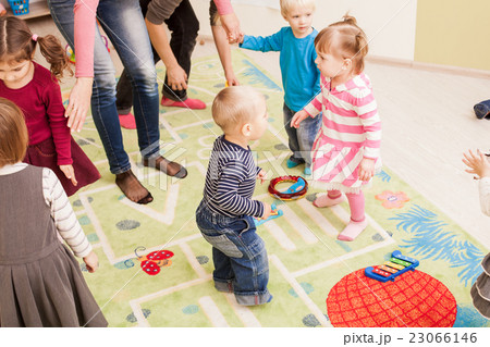 Group of little children dancing Group of little children dancing 23066146