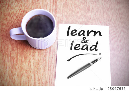 table with note writing learn and lead 23067655