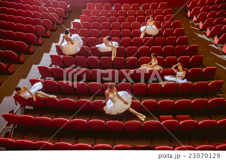 Ballerinas sitting in the empty auditorium theater Ballerinas sitting in the empty auditorium theater 23070129