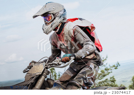 closeup dusty and dirty motorcyclist 23074417