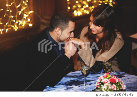 Couple enjoying each other's in a romantic dinner 23074545