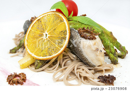 baked fish with spaghetti and mushrooms and vegeta 23076908