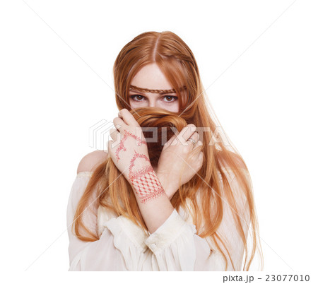 Boho hippie style young redhead woman isolated Boho hippie style young redhead woman isolated 23077010
