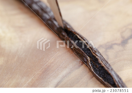 open vanilla pod on olive board open vanilla pod on olive board 23078551