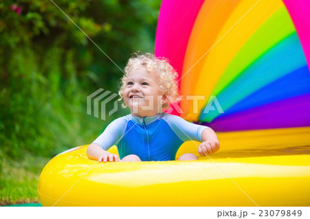Happy baby playing in swimming pool Happy baby playing in swimming pool 23079849