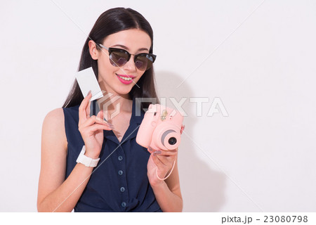 Cheerful woman standing isolated on white 23080798