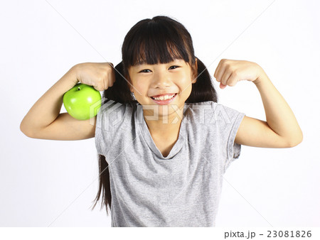 A little girl holding green apple A little girl holding green apple 23081826