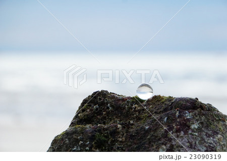 Glass bead at ocean background 23090319