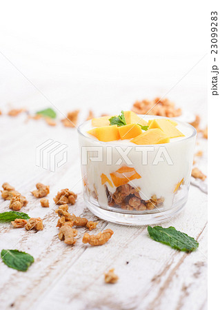 Homemade Mango Yoghurt Parfait with Granola Homemade Mango Yoghurt Parfait with Granola 23099283
