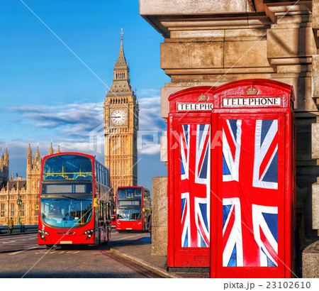 Big Ben with flags against buses in London, UK Big Ben with flags against buses in London, UK 23102610