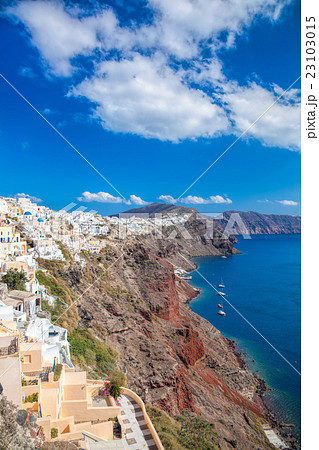 Oia village with sailboats on Santorini  in Greece 23103015