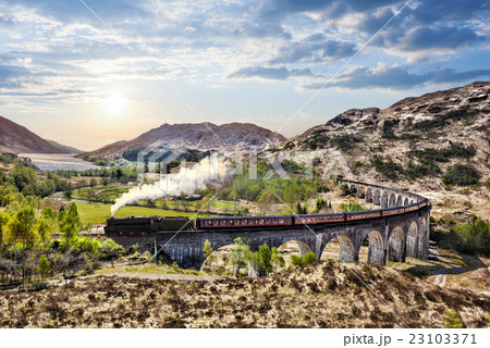 Glenfinnan Railway Viaduct in Scotland with train Glenfinnan Railway Viaduct in Scotland with train 23103371