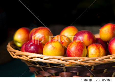 Nectarines in wooden basket nuts Nectarines in wooden basket nuts 23105401