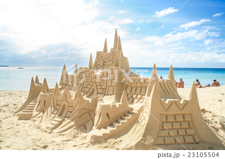 Sand castle on white sandy beach. 23105504