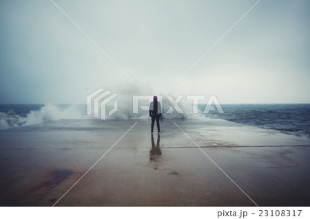 Male person enjoying rainy day alone 23108317