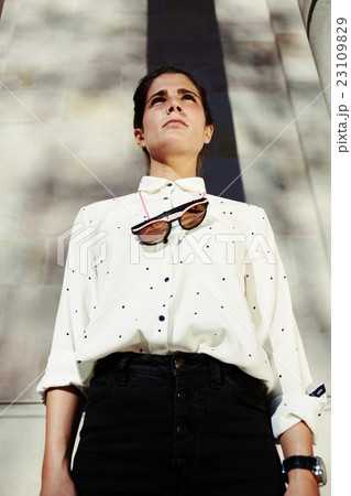 Hipster woman with serious face look in distance Hipster woman with serious face look in distance 23109829