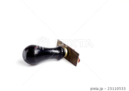 Black rubber wooden stamp on white background 23110533