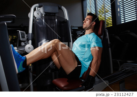 Young strong man training indoors  23112427