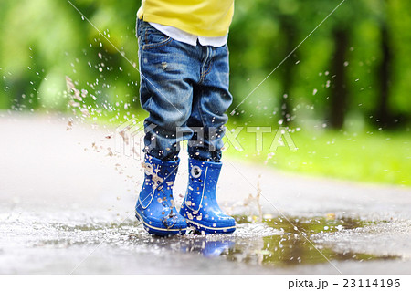 Toddler jumping in pool of water 23114196