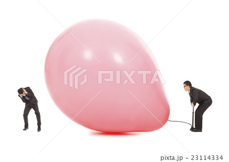 Businessmen scared balloon is inflated to burst Businessmen scared balloon is inflated to burst 23114334