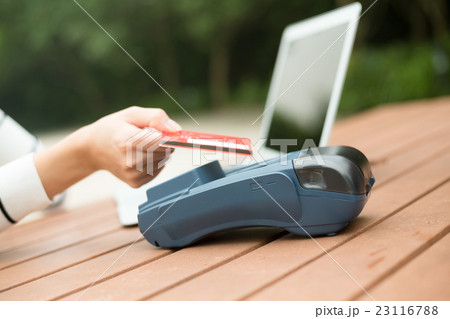 Woman pay by credit card Woman pay by credit card 23116788