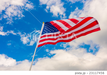 American flag on blue sky . American flag on blue sky . 23117456
