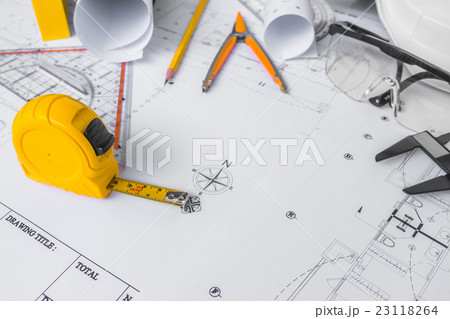 Construction plans with White helmet and drawing tools on blueprints . 23118264