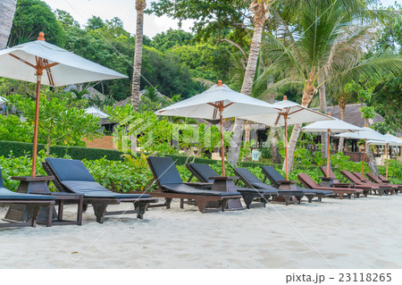 Beautiful beach chairs with umbrella on tropical white sand beach 23118265