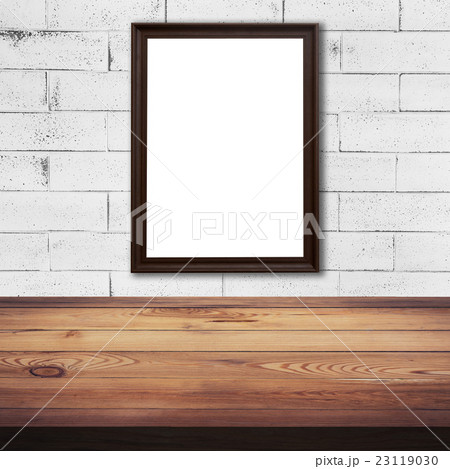 frame picture on white brick wall and wood table frame picture on white brick wall and wood table 23119030