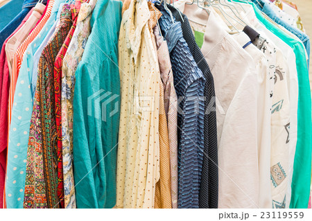 clothes hanging on a rack in a flea market clothes hanging on a rack in a flea market 23119559