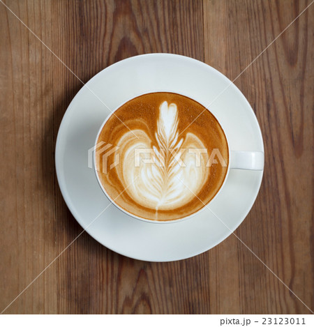 Top view latte art coffee on wood background 23123011