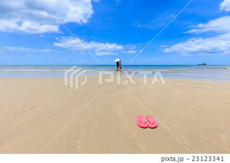 Pink sandals on the beautiful beach Pink sandals on the beautiful beach 23123341