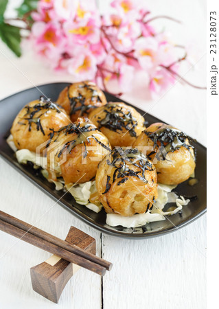 Close up of takoyaki on wooden table Close up of takoyaki on wooden table 23128073