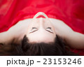 Lady in Red Dress Laying Down Eyes Closed  23153246