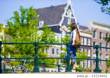 Young woman tourist taking self portrait selfie Young woman tourist taking self portrait selfie 23154602