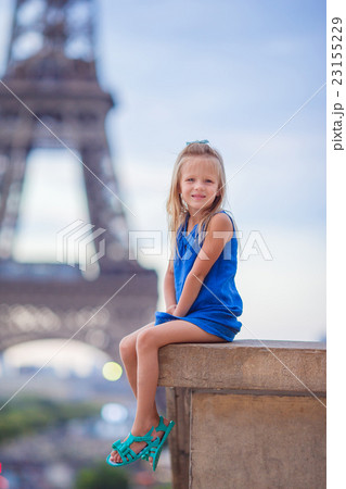 Cute little girl in Paris background the Eiffel Cute little girl in Paris background the Eiffel 23155229