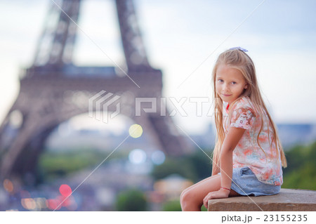 Cute little girl background the Eiffel tower 23155235