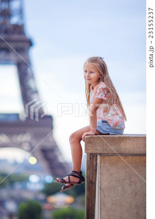 Adorable little girl near the Eiffel tower during Adorable little girl near the Eiffel tower during 23155237
